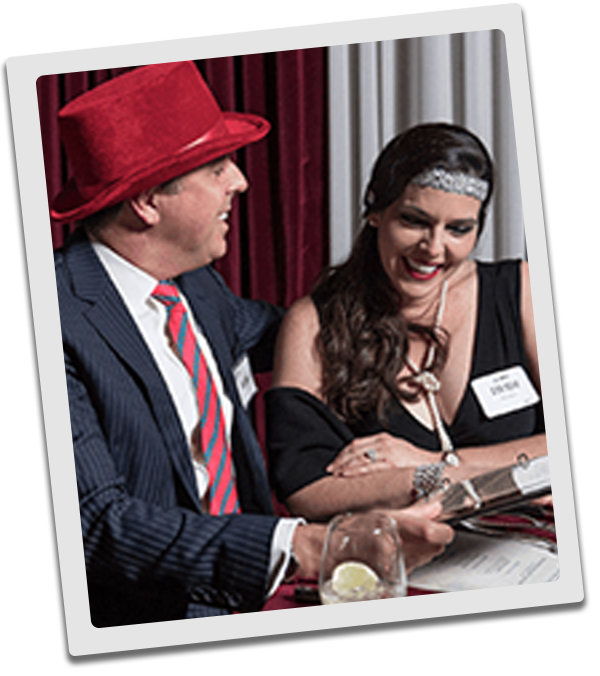 Nashville Murder Mystery couple checking out the dinner menu